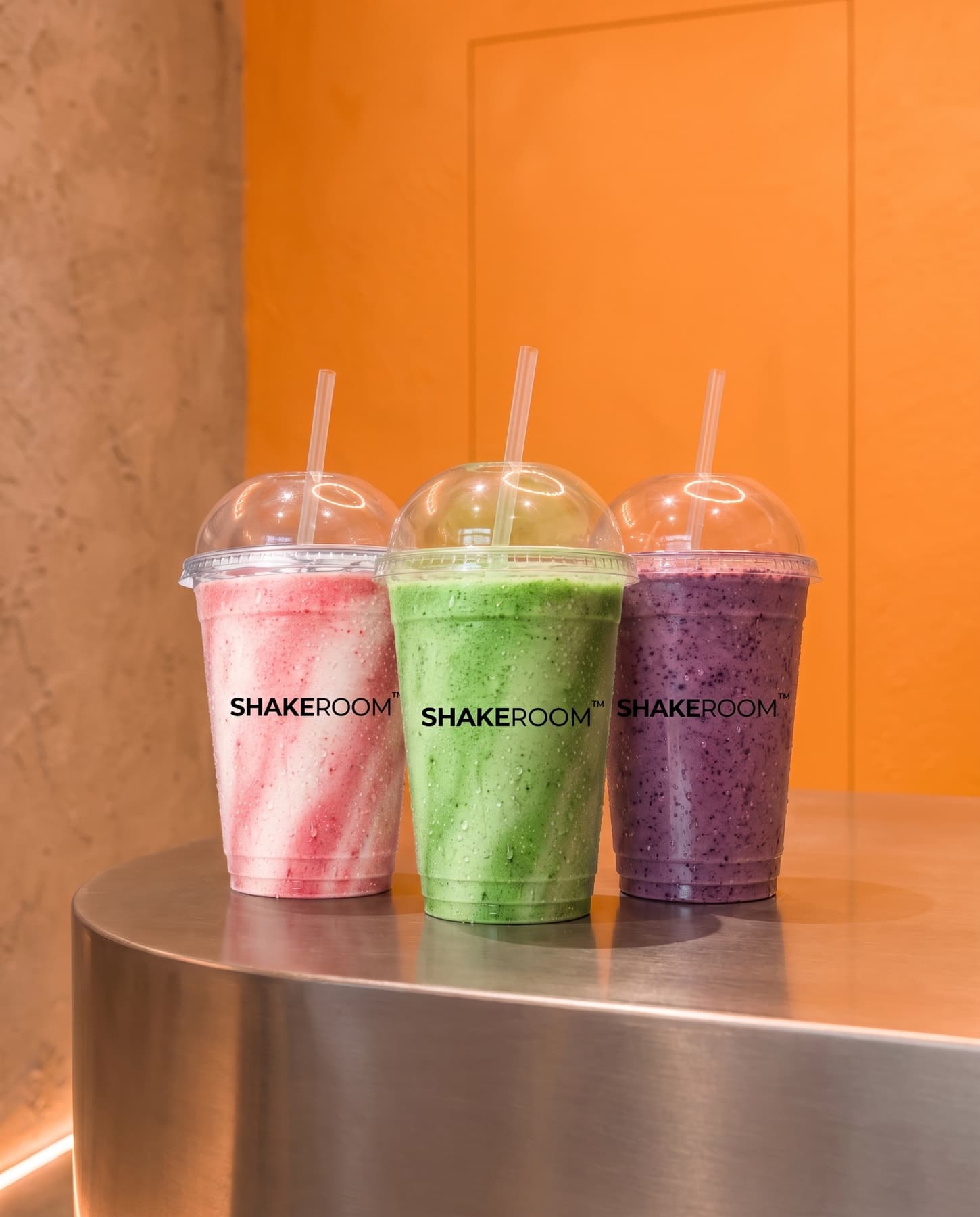 Three shakes standing on the steel counter