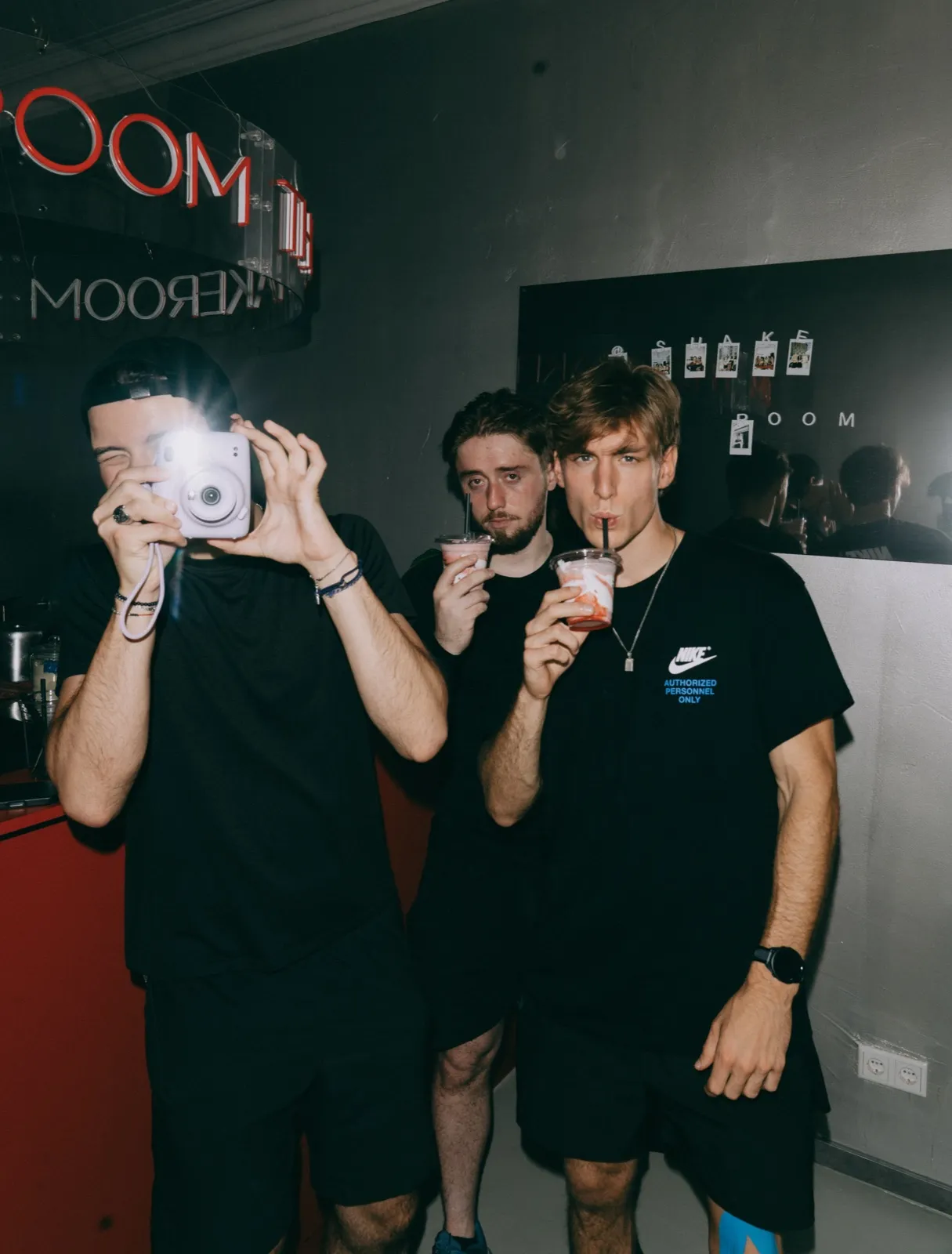 Guests with an instant camera at Shakeroom